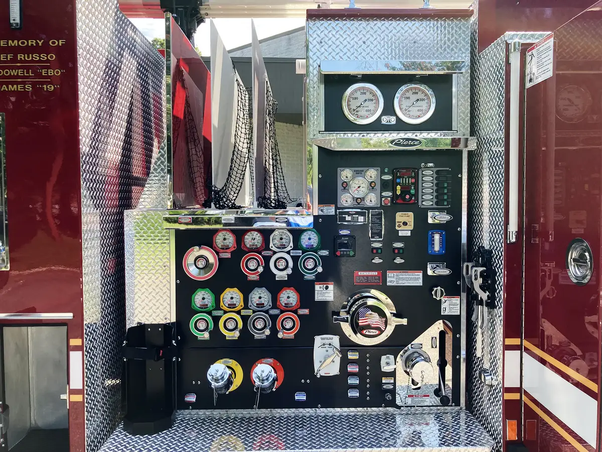 Cab interior rear-to-front view showing crew seating and front console
