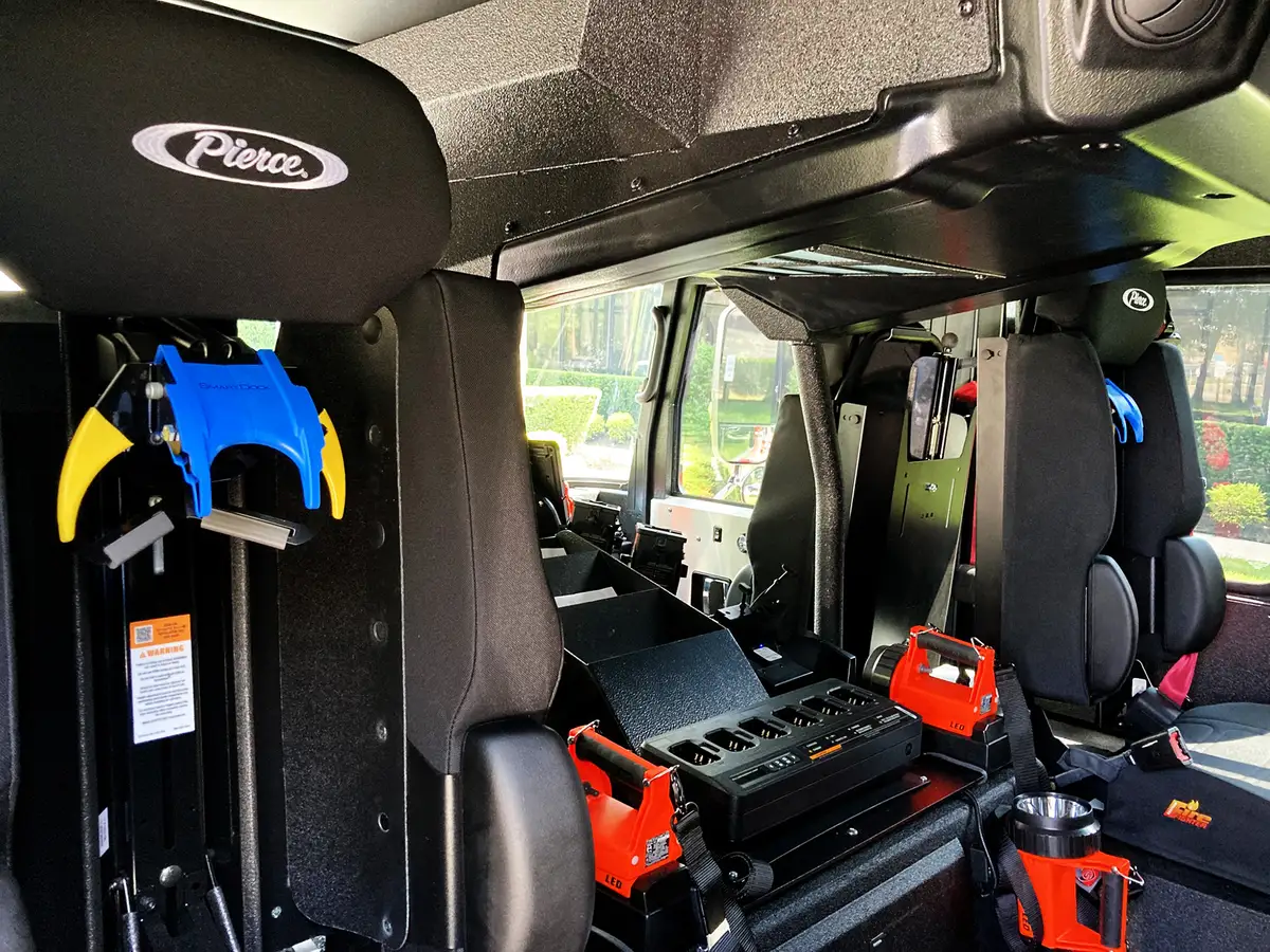 Front bumper intake close-up showing chrome intake elbow and mounting plate