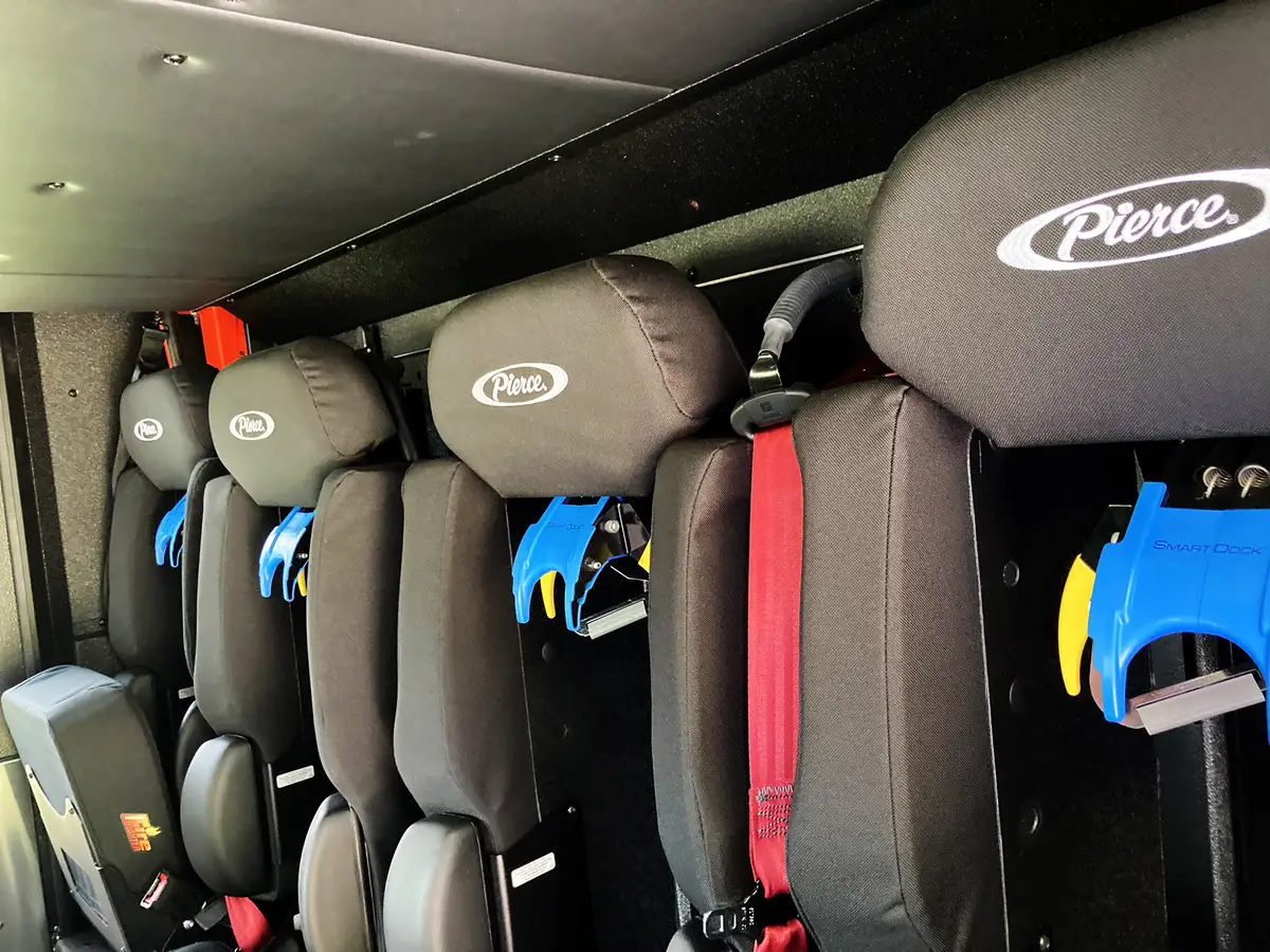 Front bumper detail showing warning lights, intake fittings, and trim