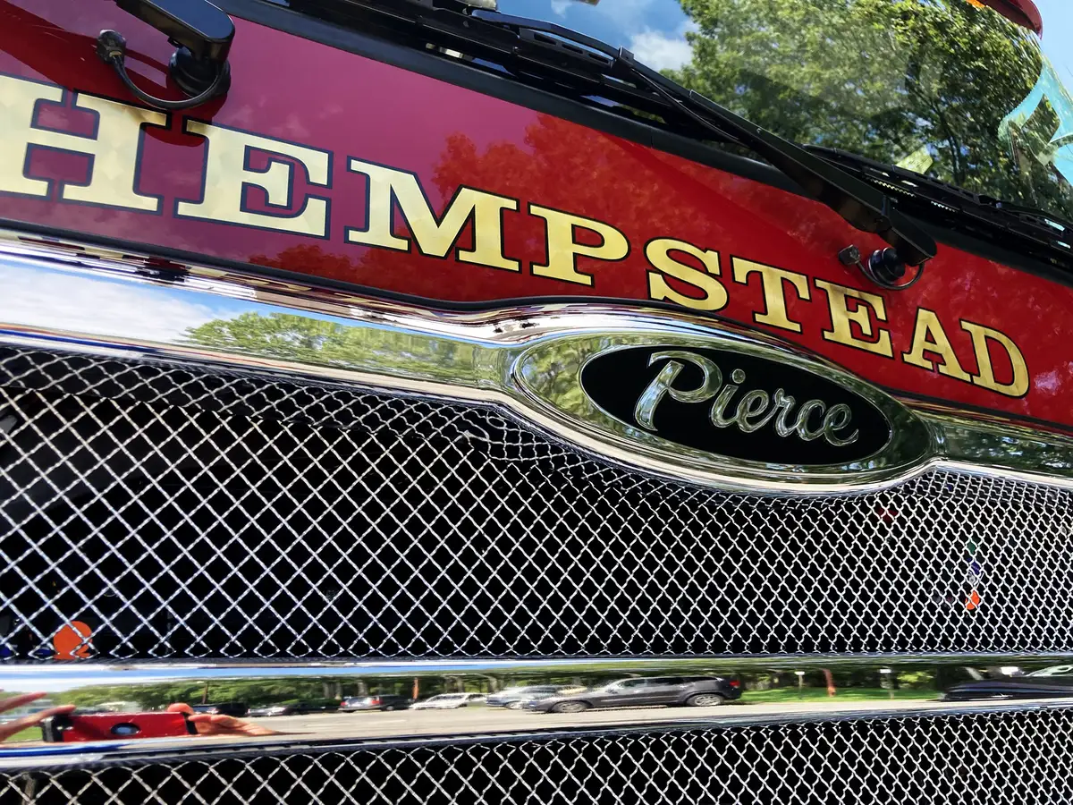 Rear warning-light cluster close-up on chevron-striped rear panel