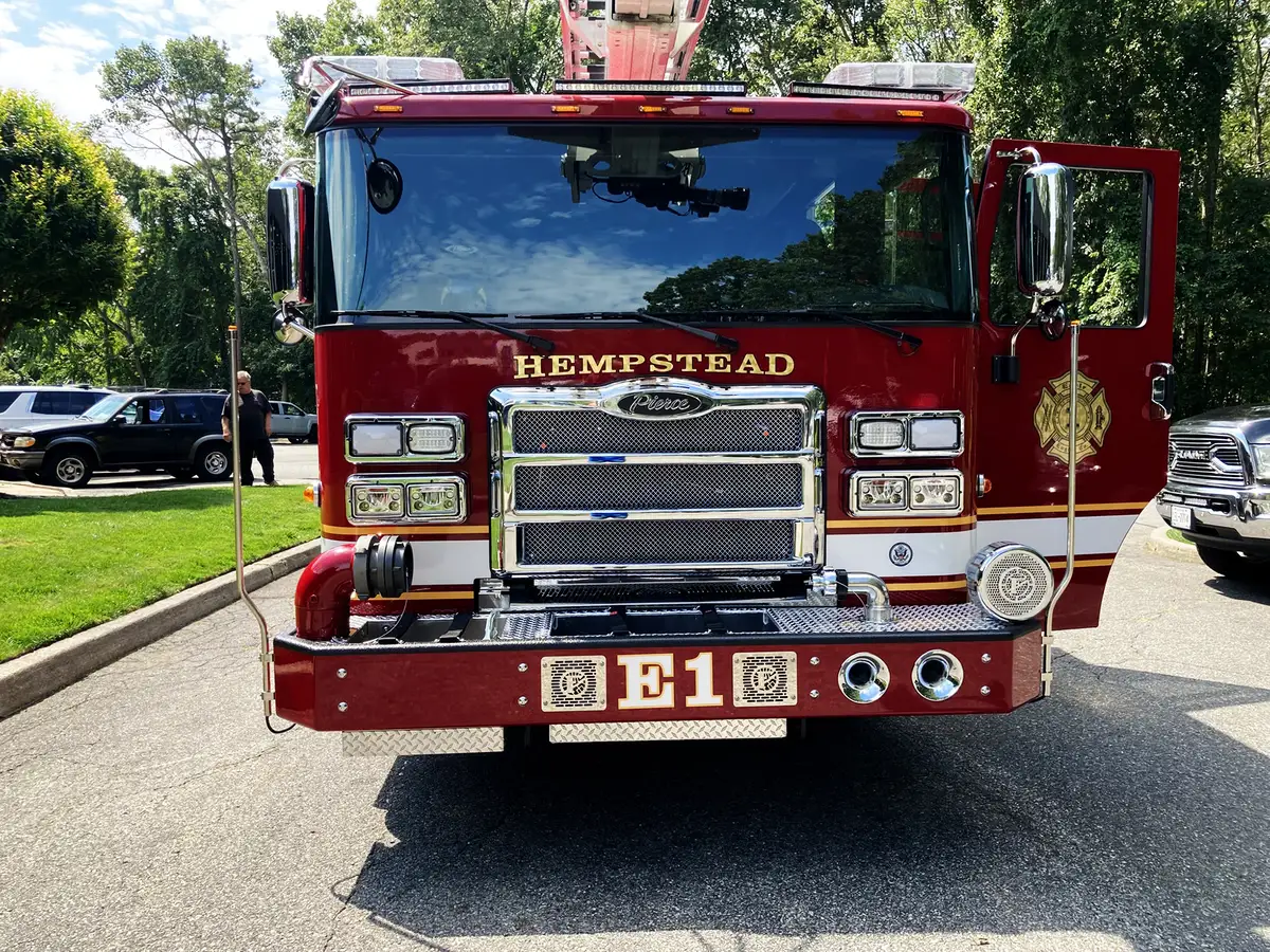 Rear intake and discharge panel close-up showing large hose connections