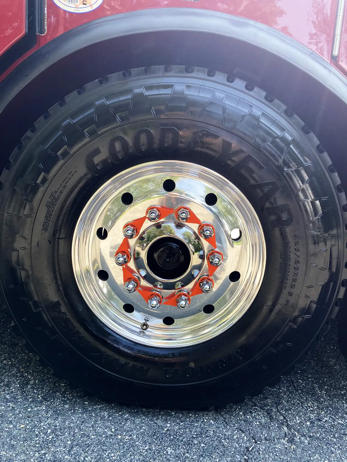 Driver-side profile view showing tandem rear wheels and side compartment doors