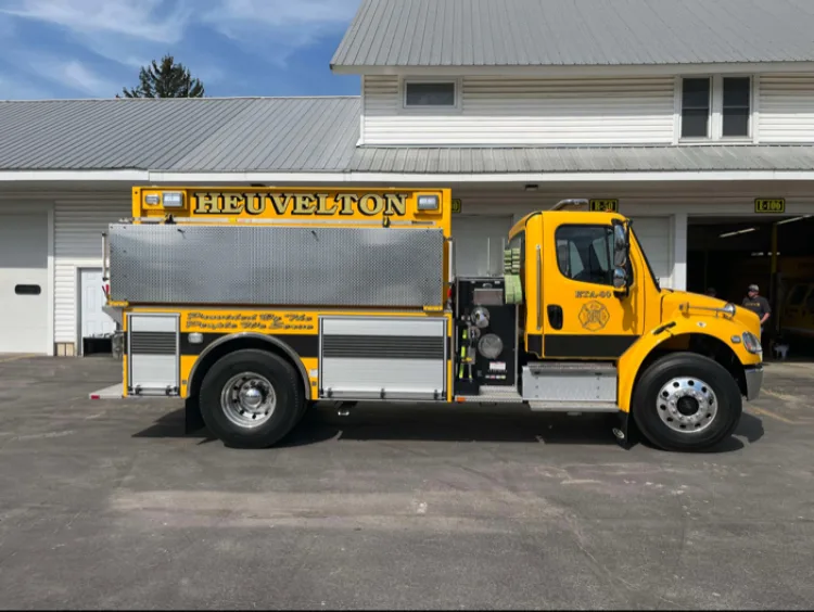 Officer-side full profile view showing roll-up compartments and side body panels
