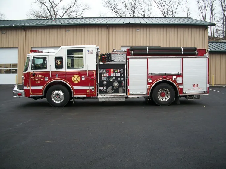 Full left-side profile highlighting the pump panel, wheel areas, and side compartment doors.