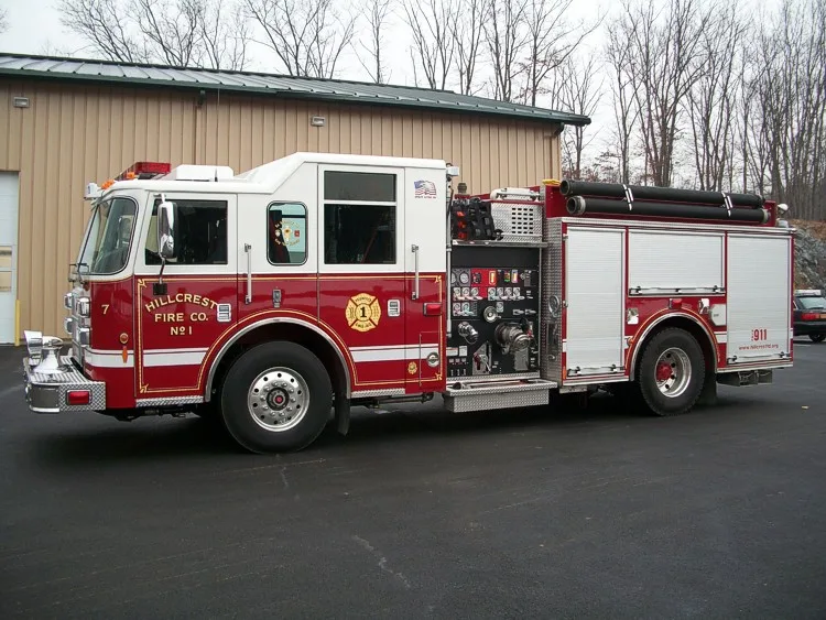 Closer left-side view focused on the pump panel controls, intake connections, and rear compartment section.