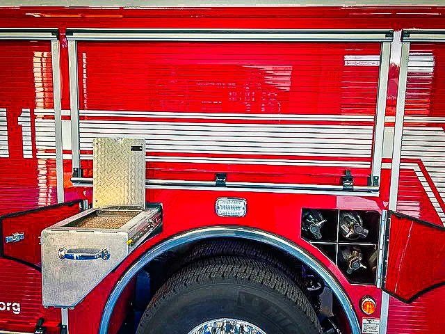 Rear pump-side panel view showing handwheel controls and hose connections