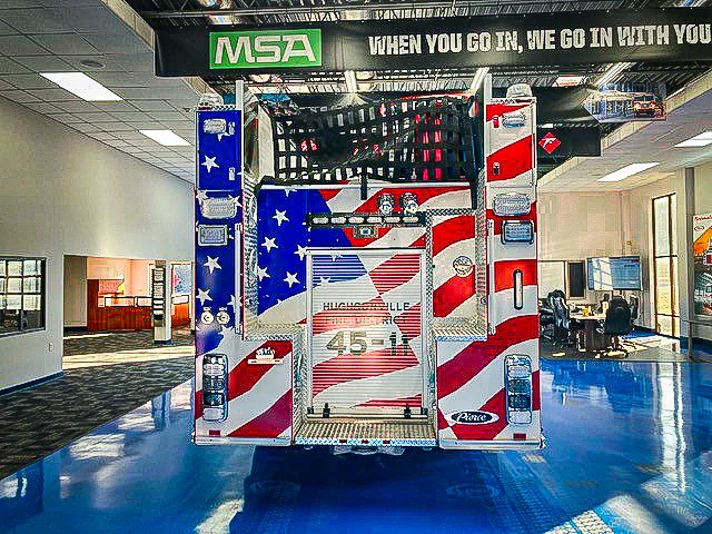 Rear view showing chevrons and American-flag style rear panel graphic