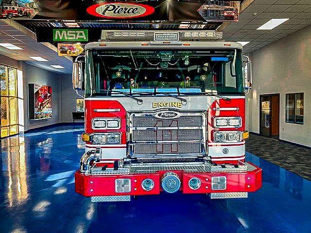 Head-on front view showing grille, bumper intake, and warning lights