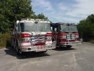 Front view of two apparatus parked side by side