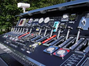 Pump panel close-up showing gauges, levers, and control labels