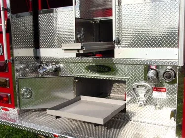 Rear step area close-up showing open pull-out trays and rear fittings