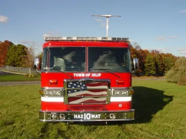 Front exterior view showing grille, bumper, and warning lights