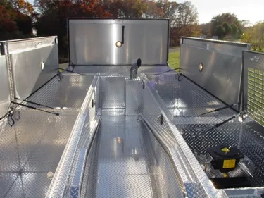 Top deck view showing open roof compartments and aluminum walkway