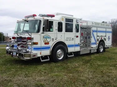 White pumper front-left exterior view showing grille and side body