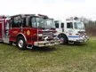 Two-pumper lineup front-left view showing red and white units