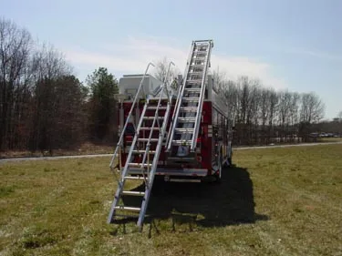 Rear view showing ladder leaned against rear of rescue body