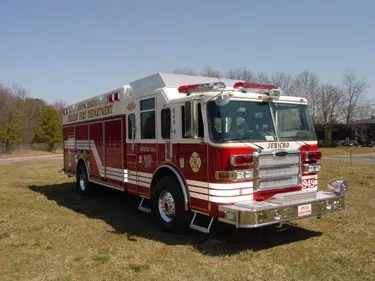 Front-left exterior profile showing heavy rescue body and side striping