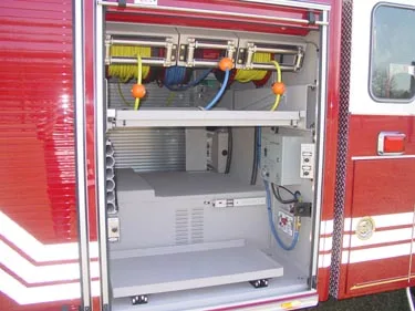 Open side compartment showing mounted tools and shelf rails