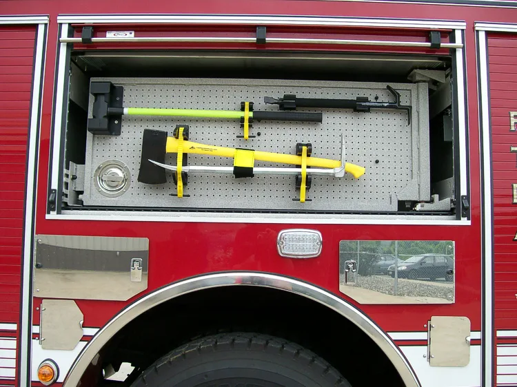 Open side compartment showing mounted hand tools and shelf storage