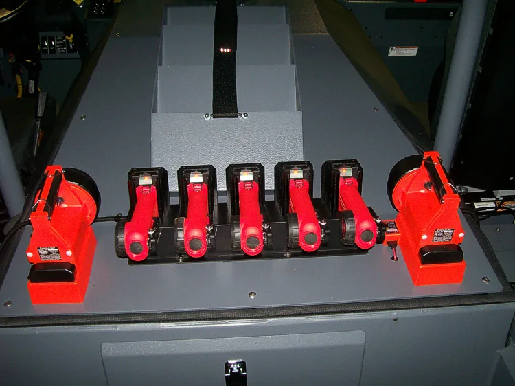 Open drawer close-up showing lined holders for hand tools and lights