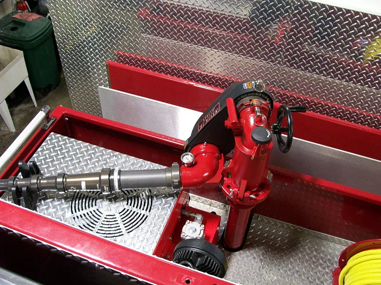 Top deck close-up showing red valve controls and mounted piping