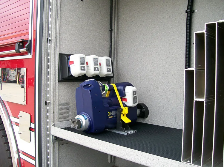 Open side compartment showing mounted power units and electrical connections