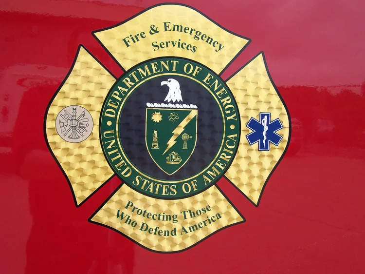 Cab door close-up showing circular crest badge on red panel