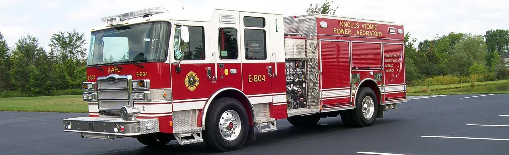 Rescue pumper driver-side profile view showing full body and closed compartments