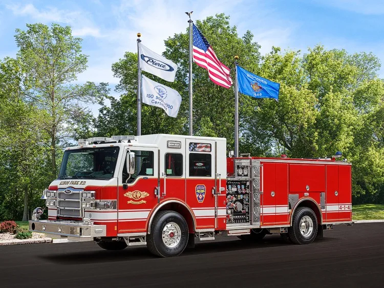 Front-left profile view of the pumper with side pump panel controls and rear compartments visible.