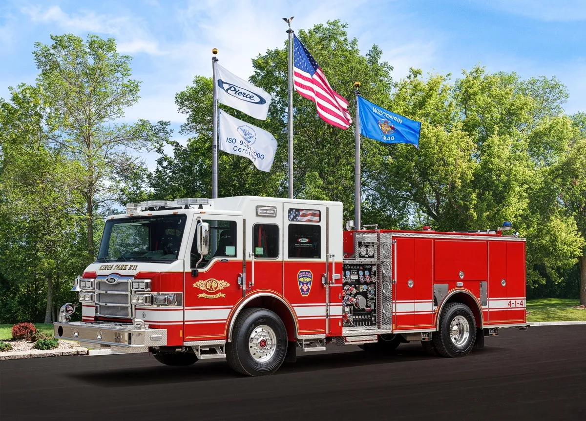 Front-left wide view showing the cab face, side pump panel area, and rear compartment body.