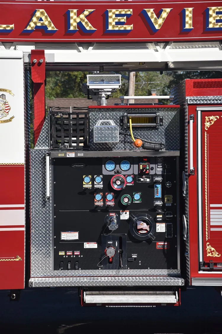 Pump panel close-up showing gauges, valves, and control handles