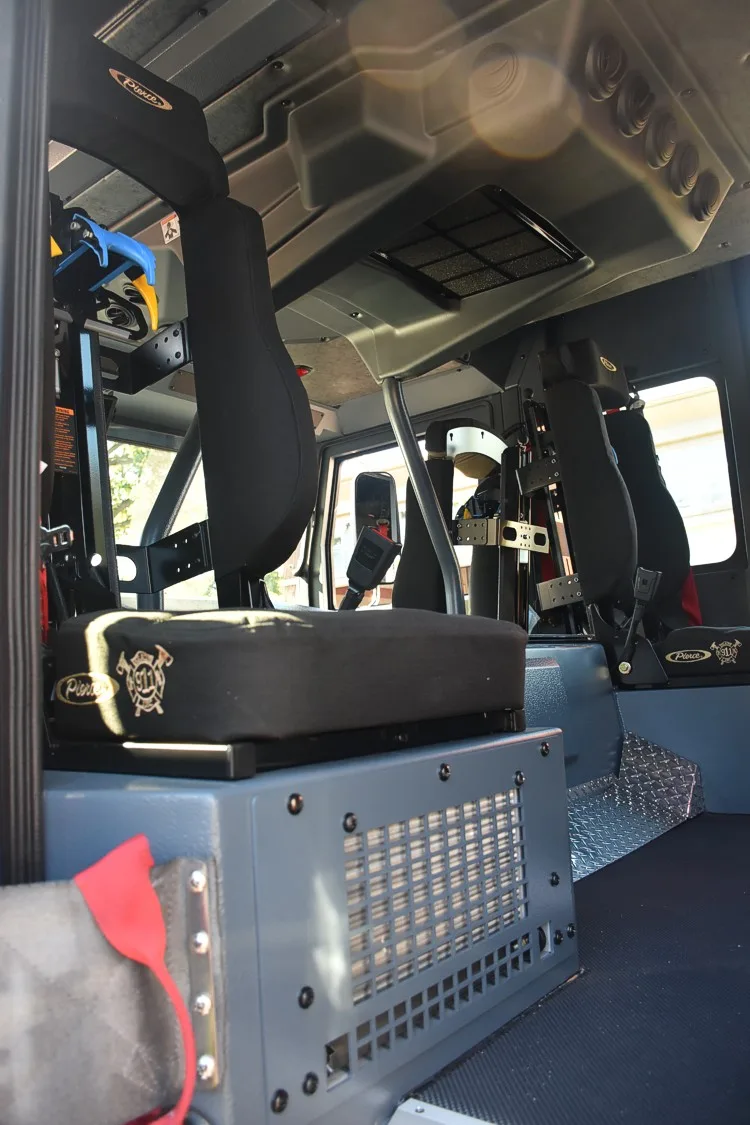Cab interior rear area showing SCBA seat mounts and grab bars