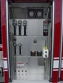Open control cabinet close-up showing gauges, levers, and electrical controls