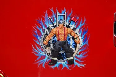 Body graphic close-up showing firefighter illustration on red panel