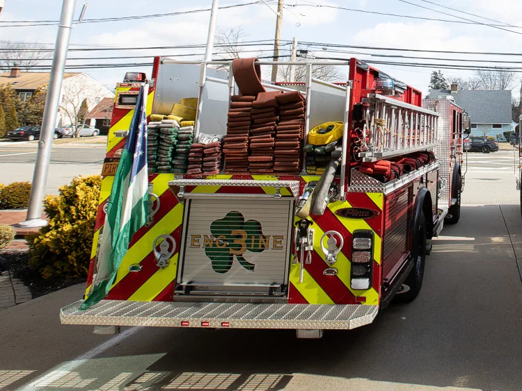 Rear-left exterior view showing chevrons and open side compartments