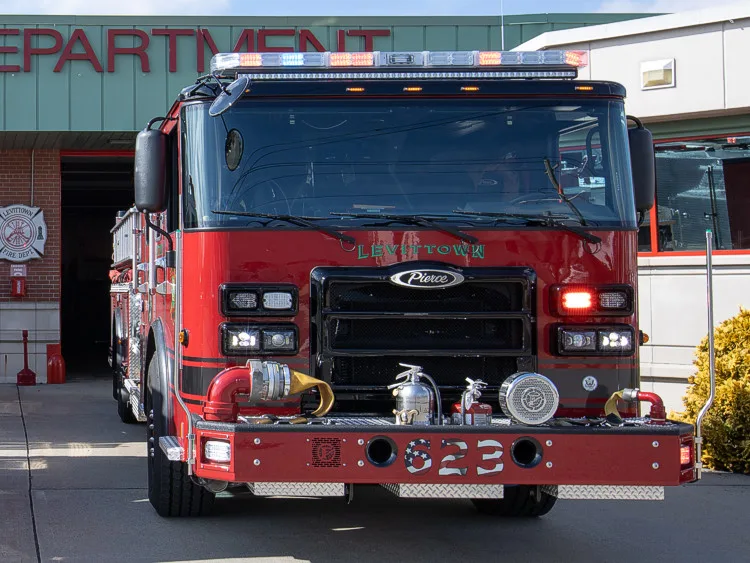 Head-on front view showing grille, bumper, and warning lights