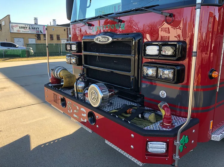Front bumper close-up showing intake ports, warning lights, and grille detail