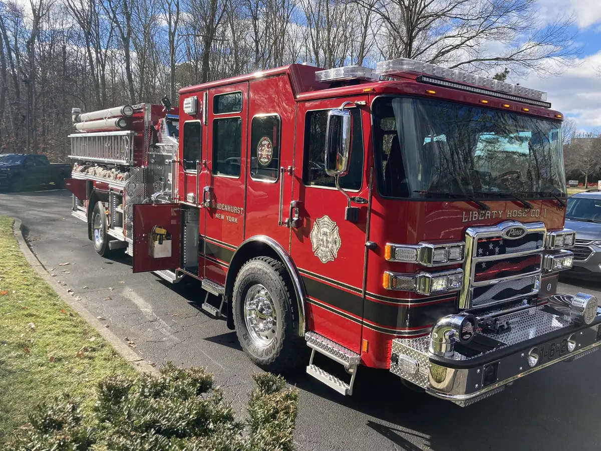 Front-right exterior view showing chrome bumper, grille, and cab corner