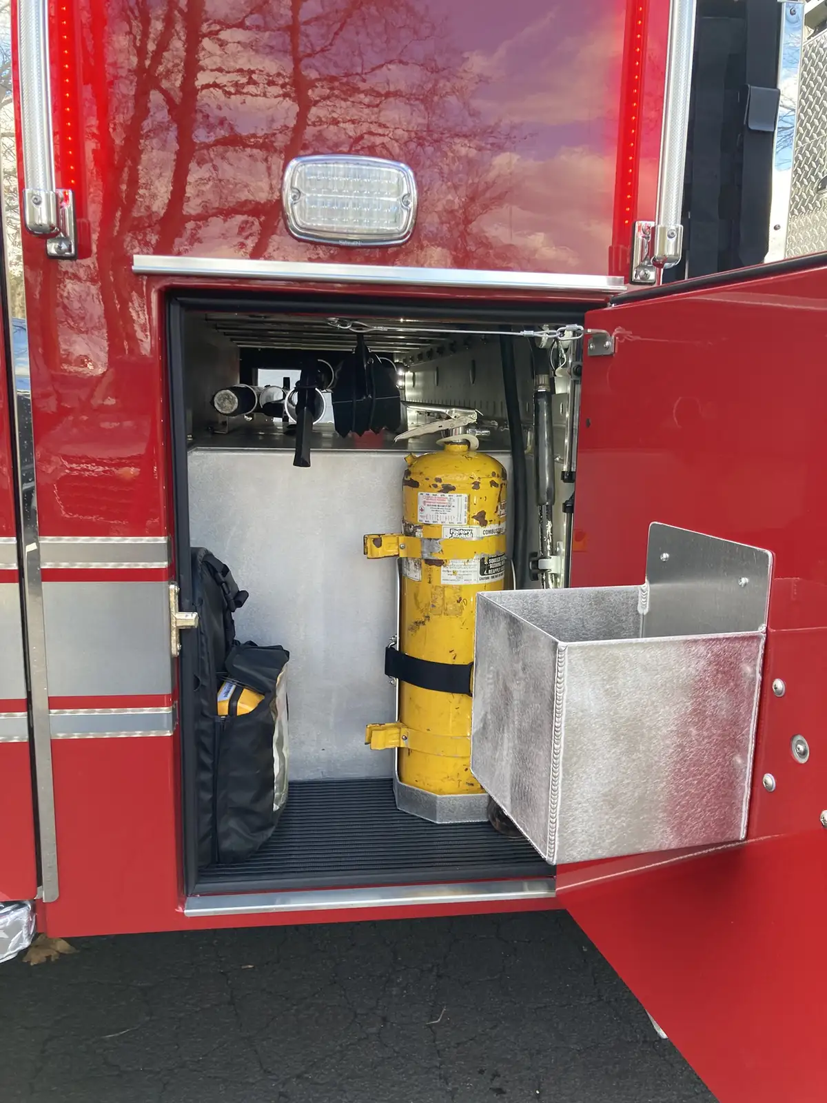 Head-on front view showing grille, warning lights, and bumper intakes