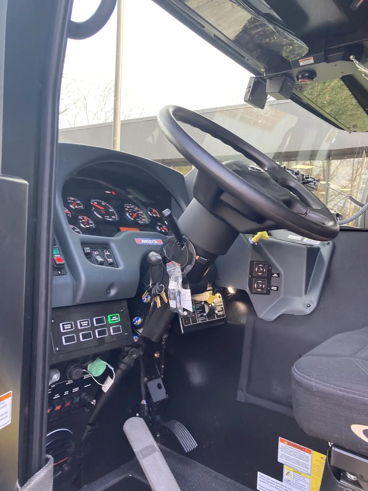 Officer-side profile view showing side compartments and wheel area