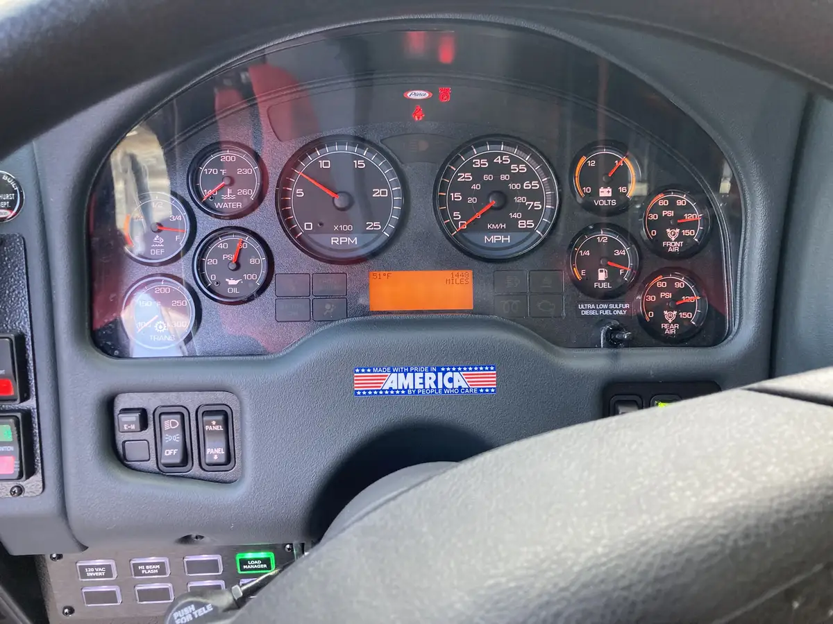 Rear-right exterior view showing chevrons, rear lights, and side body