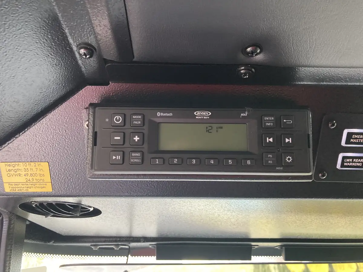 Rear-left exterior view showing hosebed rails and rear corner bodywork