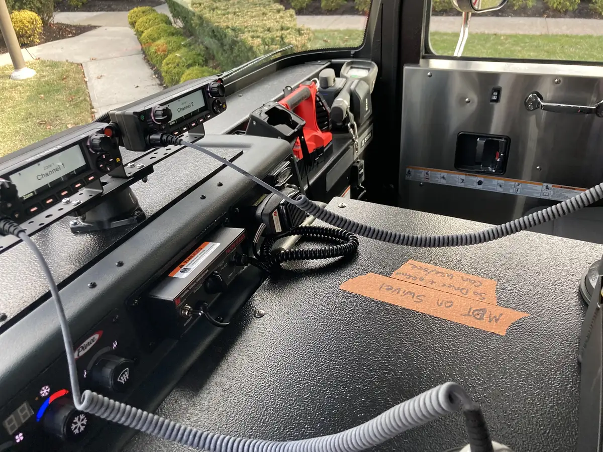 Pump panel close-up showing gauges, valve handles, and intake labels