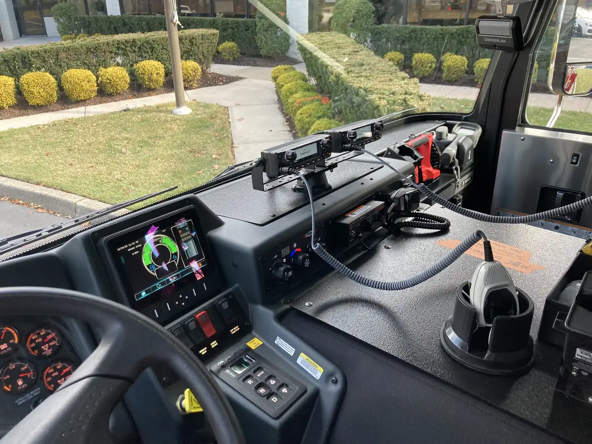 Open side compartment showing shelves, trays, and equipment storage bays