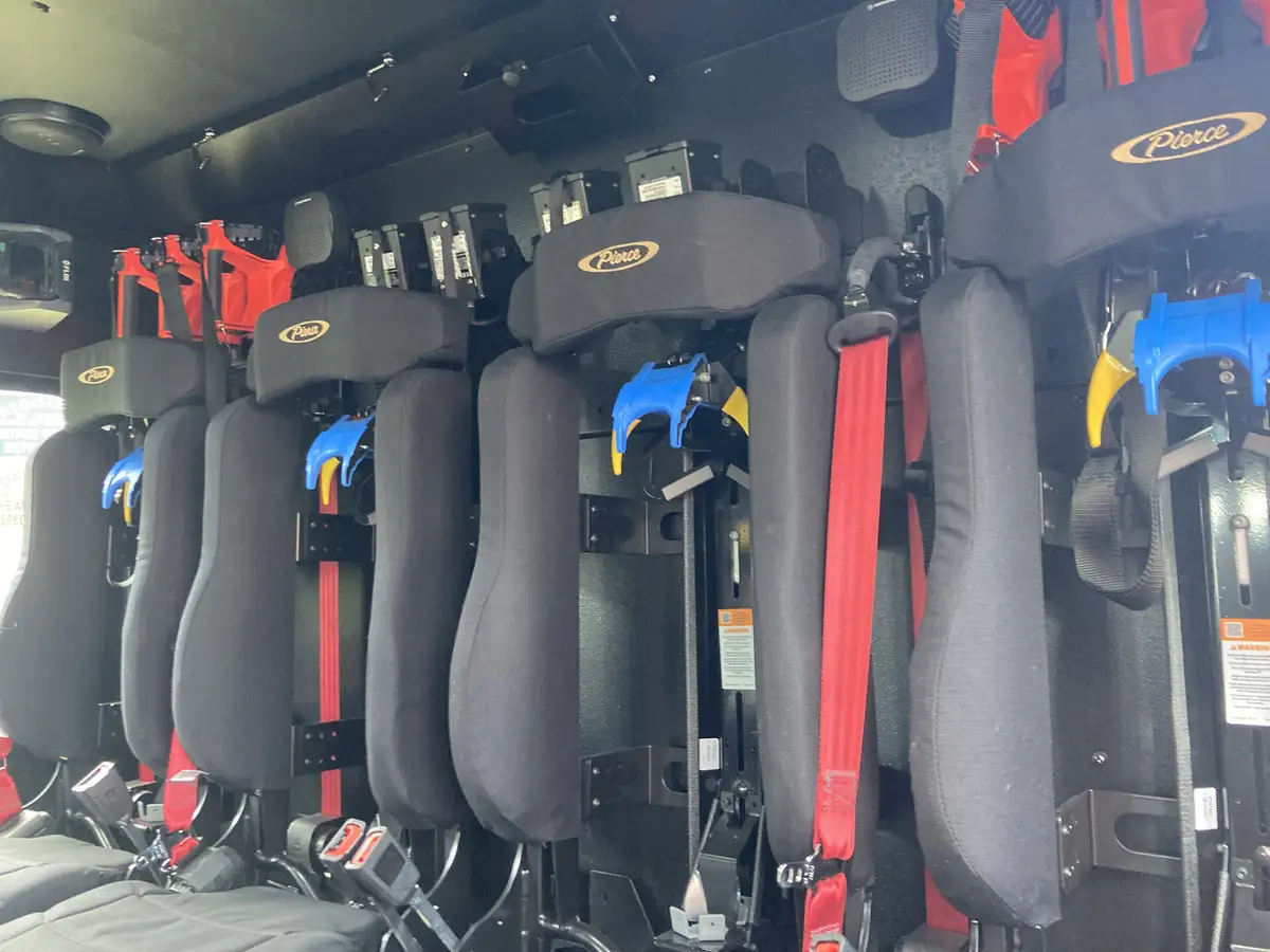 Open compartment close-up with pull-out tray and mounted tools