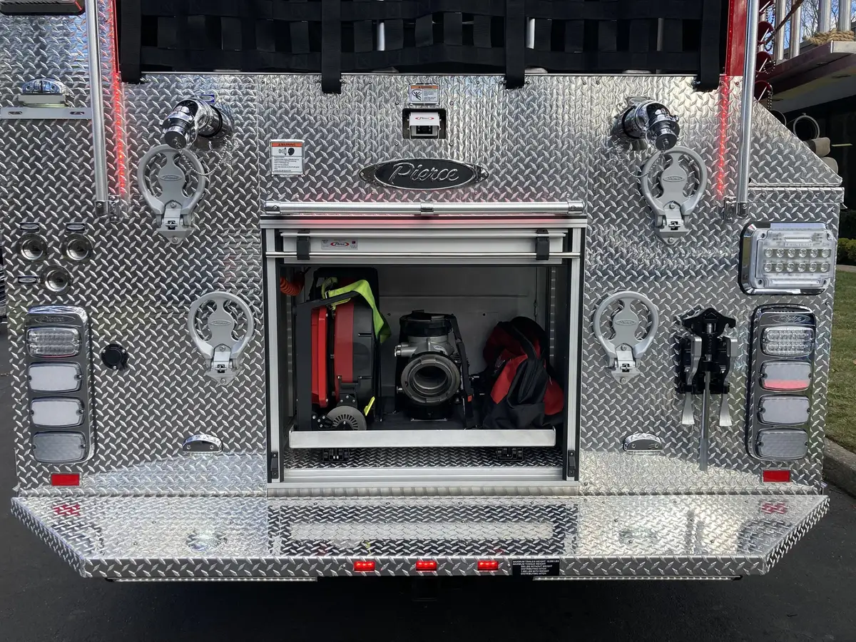 Cab door emblem close-up showing crest graphic on red paint