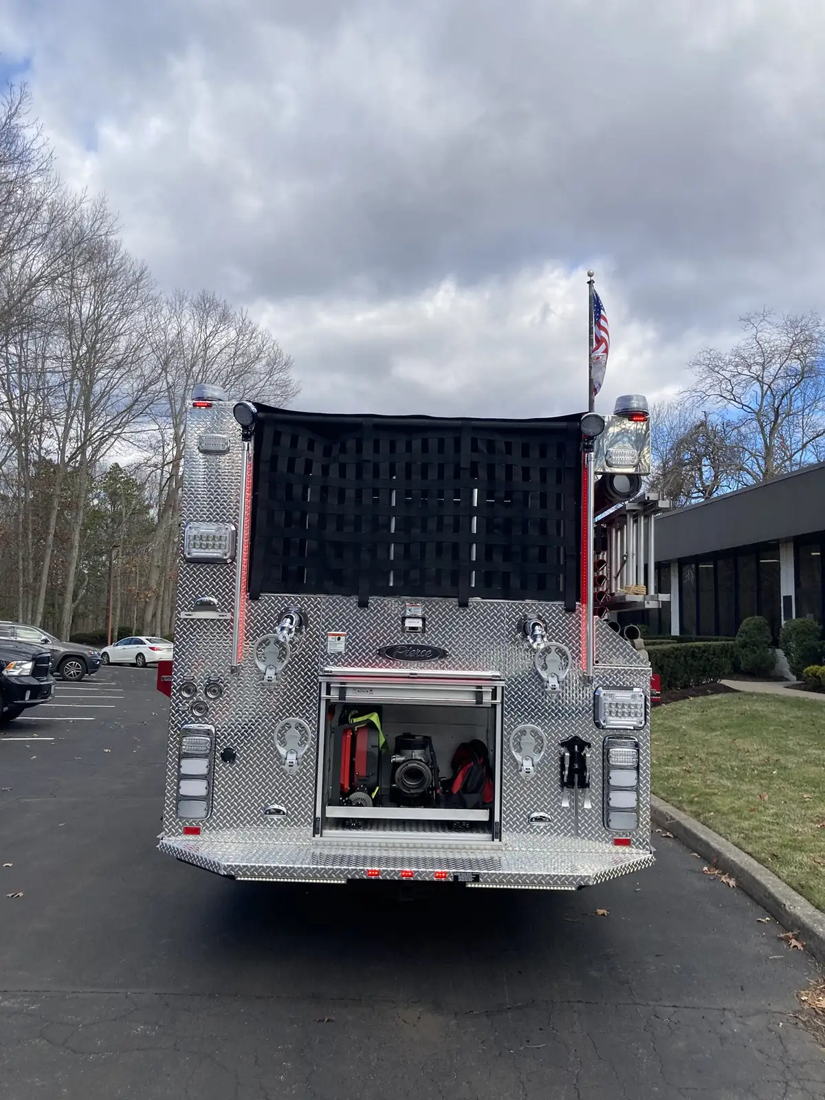 Body side logo close-up showing company-style lettering and reflective striping