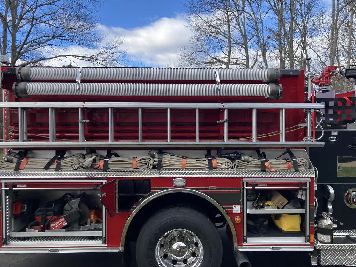 Front bumper intake close-up showing chrome intake fitting on diamond plate