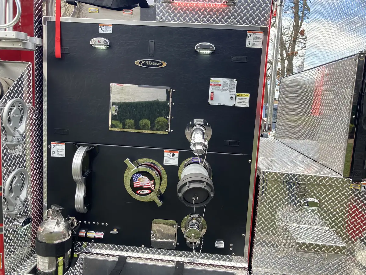 Bumper-mounted siren and intake detail close-up at front corner