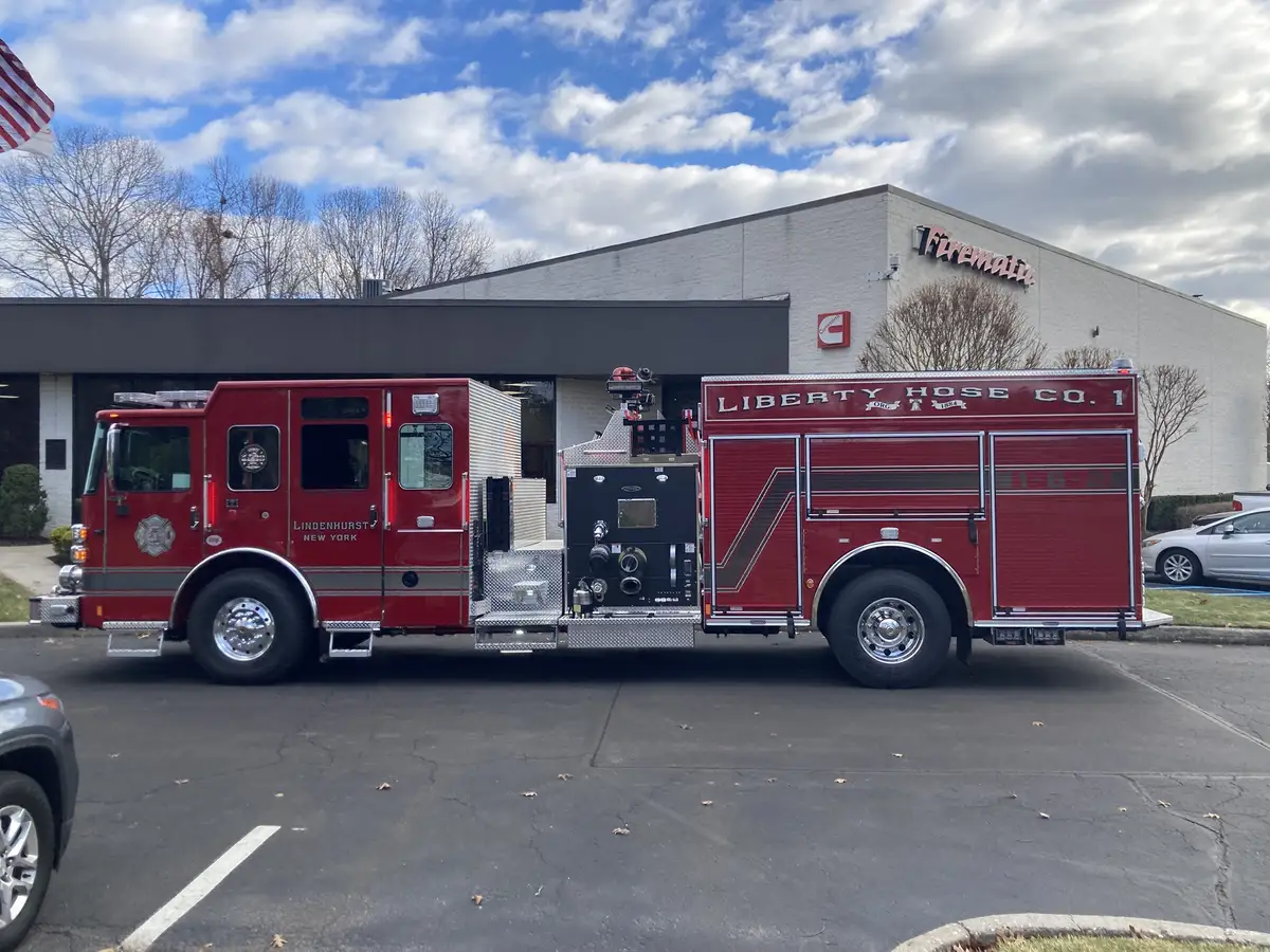 Rear-right exterior view with side compartments and rear wheel area